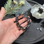 アクアマリン・黒系ビーズブレスレット 12mm玉 内周約17cm ミステリアスな輝き ユニセックス デザインブレスレット